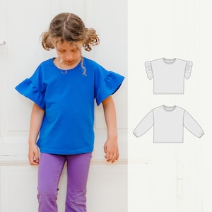 May include: A young person wearing a blue short-sleeved shirt with ruffled sleeves and purple pants. Two line drawings of shirts are shown on a white background.