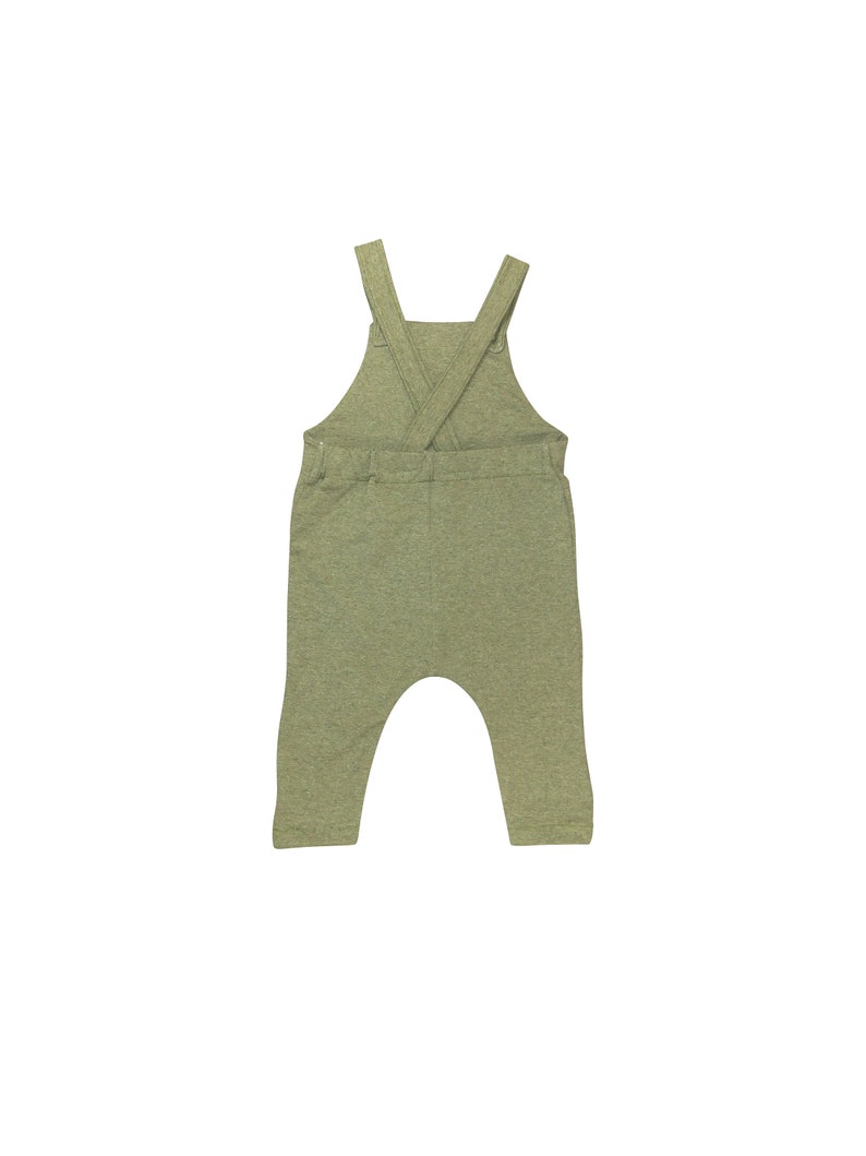May include: A green overall with a criss-cross strap design in the back.