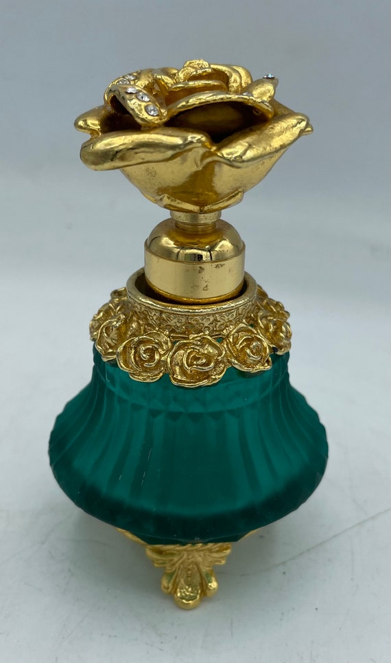 Emerald green and gold perfume bottle