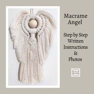 May include: Cream-colored macrame angel wall hanging with a wooden bead head and detailed wing design. The angel features a heart-shaped knot and hanging fringe. Text on the right reads "Macrame Angel Step by Step Written Instructions & Photos."