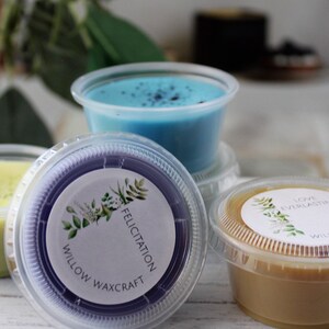 May include: Four small containers of wax melts, each with a different color and scent. The containers are labeled with the text "Willow Waxcraft" and the scent name. The scents are "Felicitatiion", "Love Everlasting", and two others.