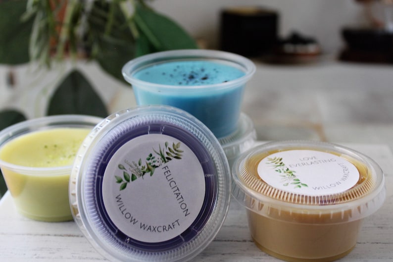 May include: Four small containers of wax melts, each with a different color and scent. The containers are labeled with the text "Willow Waxcraft" and the scent name. The scents are "Felicitatiion", "Love Everlasting", and two others.