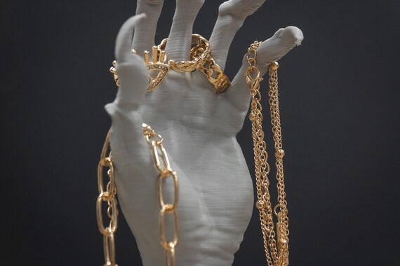Gold hand jewelry sale holder