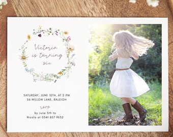 May include: A floral wreath birthday invitation for a girl turning six. The invitation features a watercolor illustration of a wreath of wildflowers and the text "Victoria is turning six". The invitation also includes the date, time, and location of the party, as well as the RSVP information.