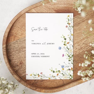 May include: Save the date card with a floral design. The card says "Save the date" for Virginia and Jeremy, April 21, 2026, Chester, Vermont.