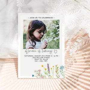 May include: A birthday invitation with a photo of a young girl blowing on a dandelion. The invitation is decorated with colorful flowers and the text "Amani is Turning 6". The invitation includes the date, time, address, and RSVP information.