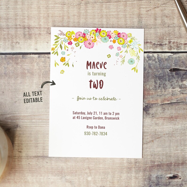 May include: A floral-themed birthday invitation for a child turning two years old. The invitation features a colorful floral garland with pink, yellow, and green flowers. The text on the invitation reads "Maeve is turning two. Join us to celebrate - Saturday, July 21, 11 am to 2 pm at 45 Lavigne Garden, Brunswick. Rsvp to Dana 930-782-7834."