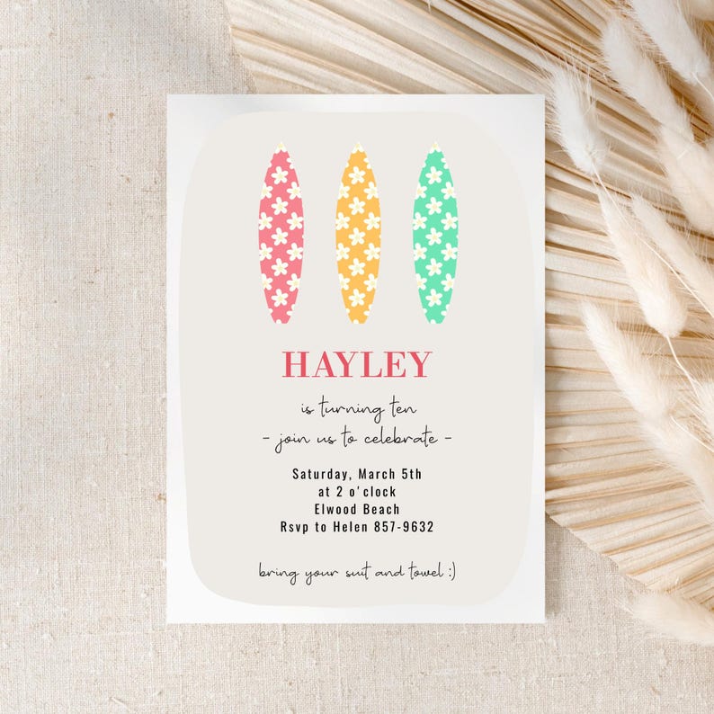 May include: A party invitation with a light beige background. The invitation features three colorful surfboard illustrations in pink, yellow, and green, each adorned with white flower patterns. The text reads "HAYLEY is turning ten - join us to celebrate".
