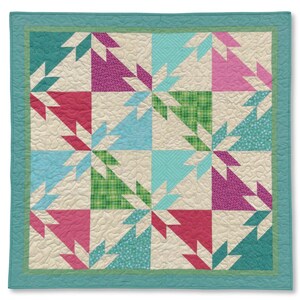 May include: A square quilt featuring a repeating star pattern in shades of magenta, pink, teal, and green. The design includes cream-coloured fabric with a stippled texture, bordered by a solid teal frame with a quilted finish throughout.