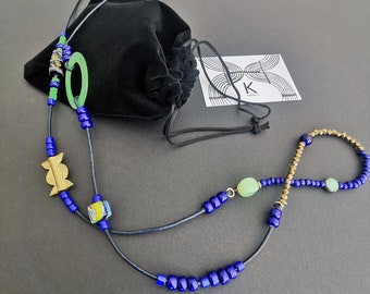 Long thin hippie chic asymmetrical necklace with midnight blue and African bronze beads