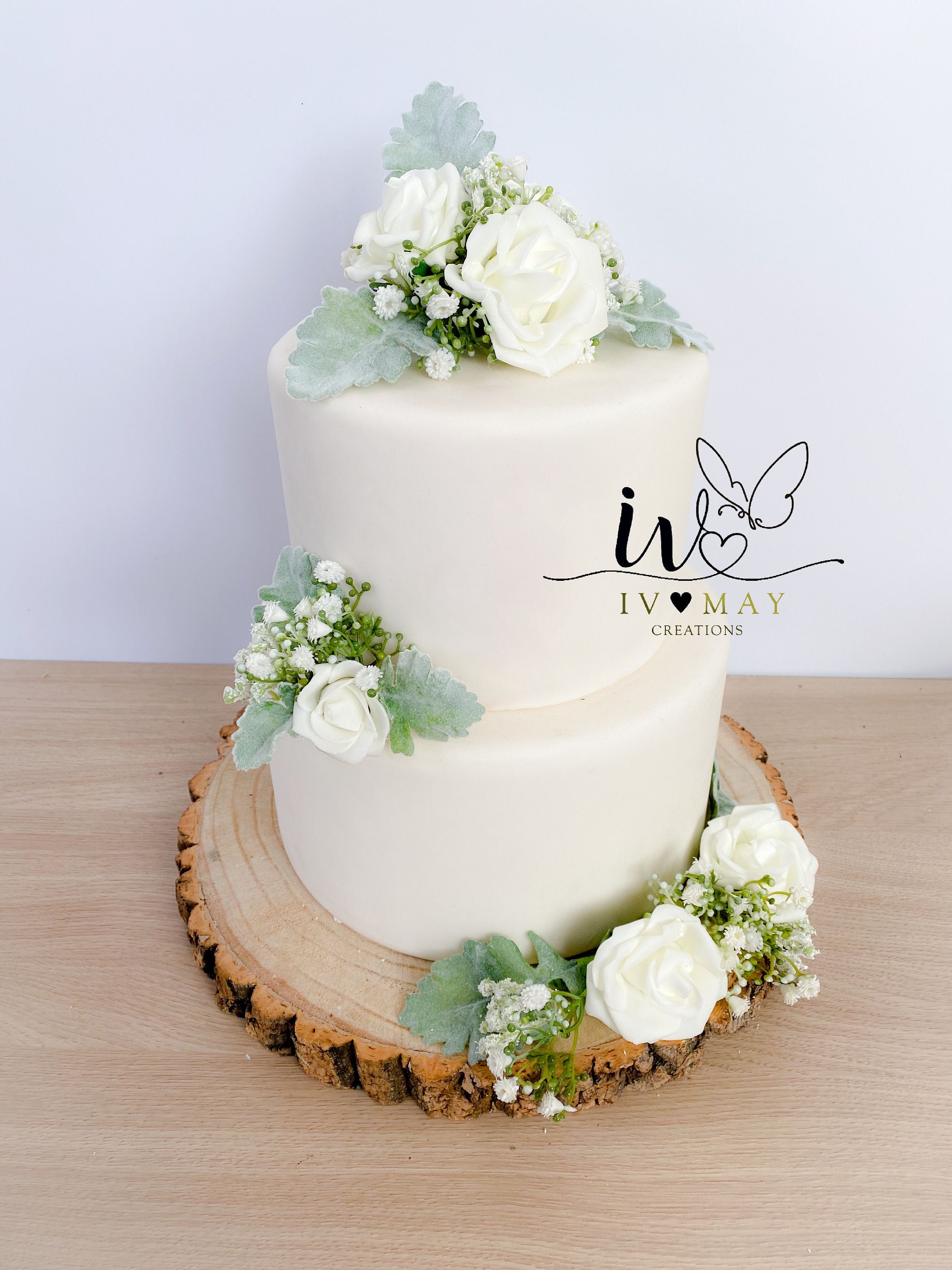 Buttercream finished wedding cake with fresh lavender and gypsophila on  rustic tree stum  Wedding cake gypsophila Wedding cake table Rustic  wedding cake toppers