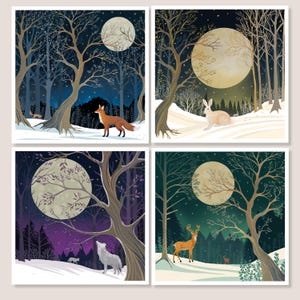 May include: Four square art prints showing winter forest scenes under a full moon. Each print features a different animal: a fox, a rabbit, a wolf, and a deer. The artwork uses a muted colour palette with blues, greens, and browns.