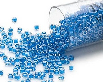 Seed bead, Delica®, glass, transparent color-lined electric blue, (DB0920), #11 round, DB-0920