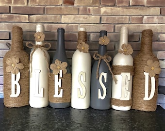 Gray and cream Blessed decorated wine bottle set.