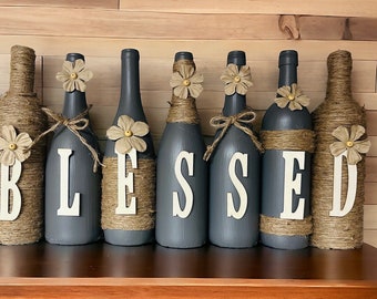 Gray Blessed decorated wine bottle set.
