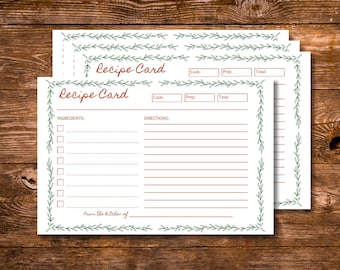 May include: White recipe cards with a green leaf border and the words "Recipe Card" in a script font. The cards have sections for ingredients, directions, and cooking times. The phrase "From the kitchen of" is also included.