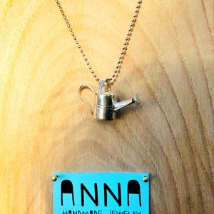 Silver watering can