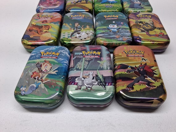 pokémon - trading card game: kanto friends mini tin Empty Pokemon Tins Updated 7/8 or Eevee—and contains two booster packs along with a matching Cosmo holo card Pokemon Kanto Friends Bulbasaur Mini