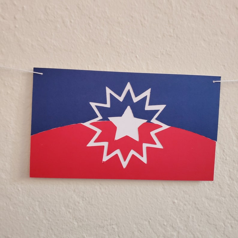 May include: A red, white, and blue flag with a white star in the center of a white starburst.