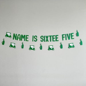 May include: Green banner with the text "NAME IS SIXTEE FIVE" and golf cart and golf bag cutouts.