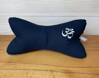 Reading pillow embroidered with Om symbol
