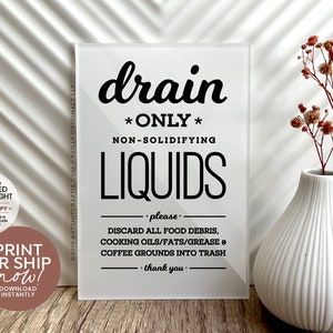 May include: A white sign with black text that reads "drain *ONLY* NON-SOLIDIFYING LIQUIDS - please - DISCARD ALL FOOD DEBRIS, COOKING OILS/FATS/GREASE & COFFEE GROUNDS INTO TRASH - thank you."