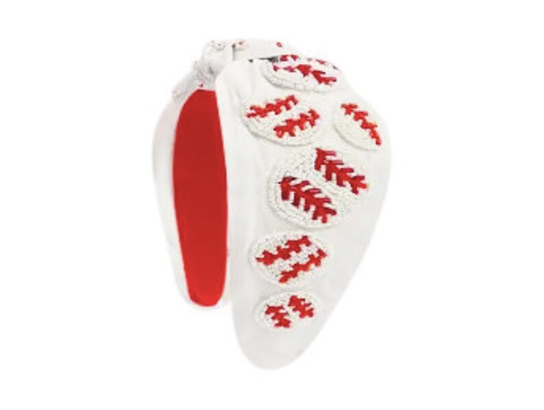 May include: White headband with red and white baseballs sewn on. The baseballs are made of beads.