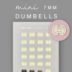 Op de afbeelding: Een vel met mini halterstickers in goud en zwart. De tekst "mini 7MM DUMBELLS" staat bovenaan. Een ronde sticker met een halterontwerp staat in de rechterbovenhoek. De vellen hebben de tekst "notes & clips • DUMBELLS • 212PC".