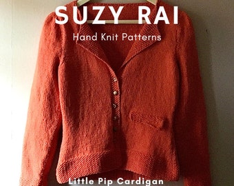 Puede incluir: Un cárdigan de punto naranja brillante con cierre de botones y un bolsillo en el lado derecho. El cárdigan está etiquetado como "Suzy Rai Hand Knit Patterns Little Pip Cardigan".