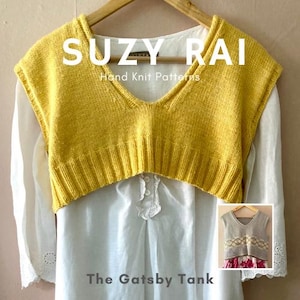 May include: A mustard yellow knitted vest with a V-neck hangs on a wooden hanger over a white blouse. The text "SUZY RAI Hand Knit Patterns" and "The Gatsby Tank" are visible. A smaller image of a similar vest is in the bottom right corner.