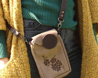 Brown leather crossbody phone bag for her with laser engraved rose flowers.