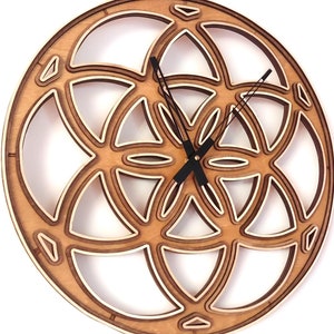 May include: A wooden wall clock featuring a geometric design in the shape of a flower of life. The clock has black hands and a white background.