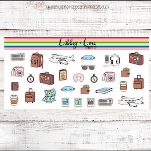 May include: A sheet of travel themed stickers featuring a variety of items including a passport, airplane, luggage, sunglasses, a camera, a neck pillow, and a compass. The stickers are white with black outlines and colorful accents.