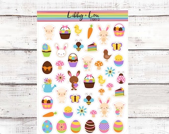 May include: A sheet of Easter-themed stickers featuring a variety of cute characters and objects, including bunnies, chicks, eggs, baskets, flowers, and a bee. The stickers are printed on white paper with a clear background.