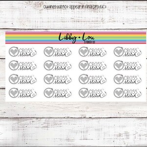 May include: A sheet of 16 white, round stickers with a black and white cross stitch design of a heart in a hoop. The text "CROSS STITCH" is written in a cursive font below the design. The text "Libby + Lou STICKER CO" is written at the top of the sheet.