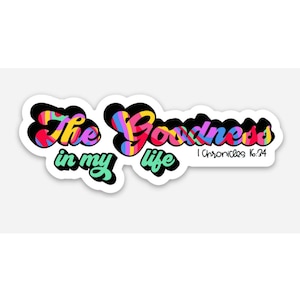 May include: A sticker with the text "The Goodness in my life" in colorful, stylized lettering. The text "1 Chronicles 16:34" is also included in smaller font.