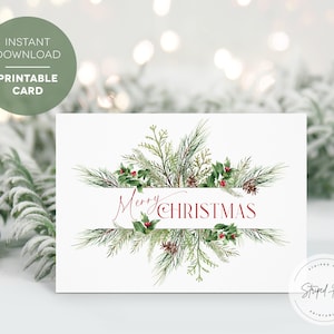 May include: A white Christmas card with a watercolor design. The card features the words "Merry Christmas" in red script, framed by green pine branches, red berries, and pine cones. The card is a printable download.