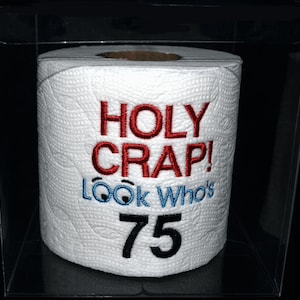 Holy Crap 75th birthday embroidered toilet paper in clear gift box. Perfect gag gift, table decoration, or party centerpiece decoration!