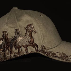Earth color hat with embroidered mustangs scene design with embroidered back name personalization