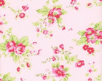 May include: A pink floral fabric with a repeating pattern of small pink and red flowers with green leaves.
