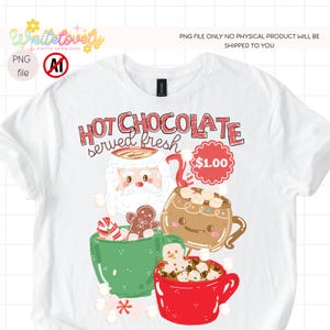 May include: A white t-shirt featuring a graphic design with the text "HOT CHOCOLATE served fresh" and "$1.00". The illustration includes a Santa Claus face, a brown mug with a face, a green mug, a red mug, marshmallows, and a gingerbread man.