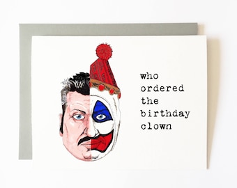 May include: A birthday card with a cartoon illustration of a clown with a red, white, and blue hat. The text on the card reads "who ordered the birthday clown".