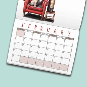 May include: A wall calendar page for February featuring a red armchair with a grey dog sitting on it next to a wine bottle on a small wooden stool. The calendar grid has black lines, white boxes, and the month name in large red capital letters.
