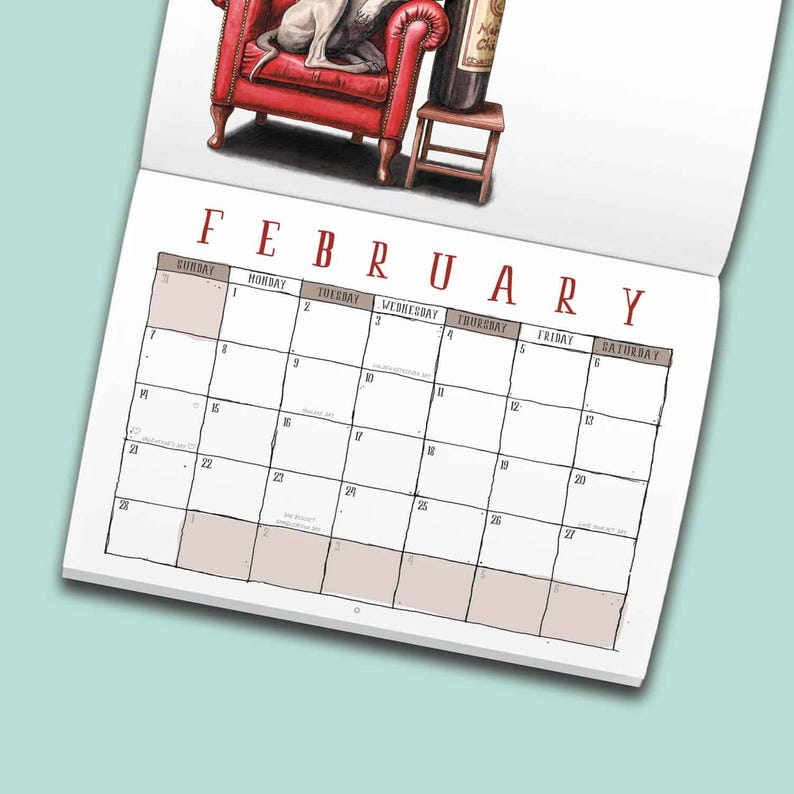 May include: A wall calendar page for February featuring a red armchair with a grey dog sitting on it next to a wine bottle on a small wooden stool. The calendar grid has black lines, white boxes, and the month name in large red capital letters.
