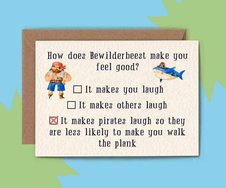 May include: A humorous card with a cartoon pirate and shark. The card asks "How does Bewilderbeest make you feel good?" and offers three multiple choice answers: "It makes you laugh", "It makes others laugh", and "It makes pirates laugh so they are less likely to make you walk the plank".