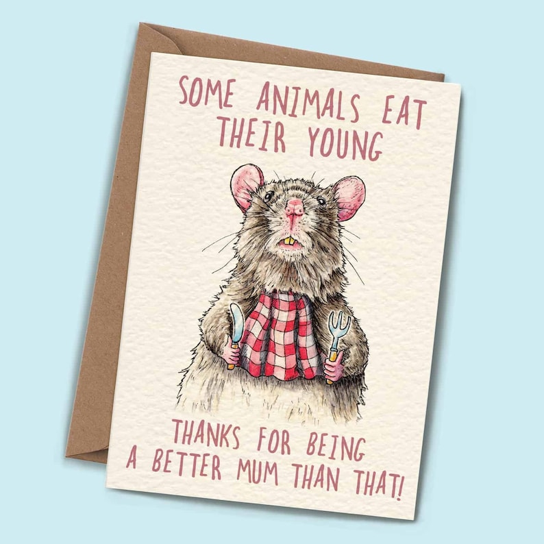 May include: A humorous greeting card featuring a cartoon rat holding a knife and fork with the text "Some animals eat their young. Thanks for being a better mum than that!"