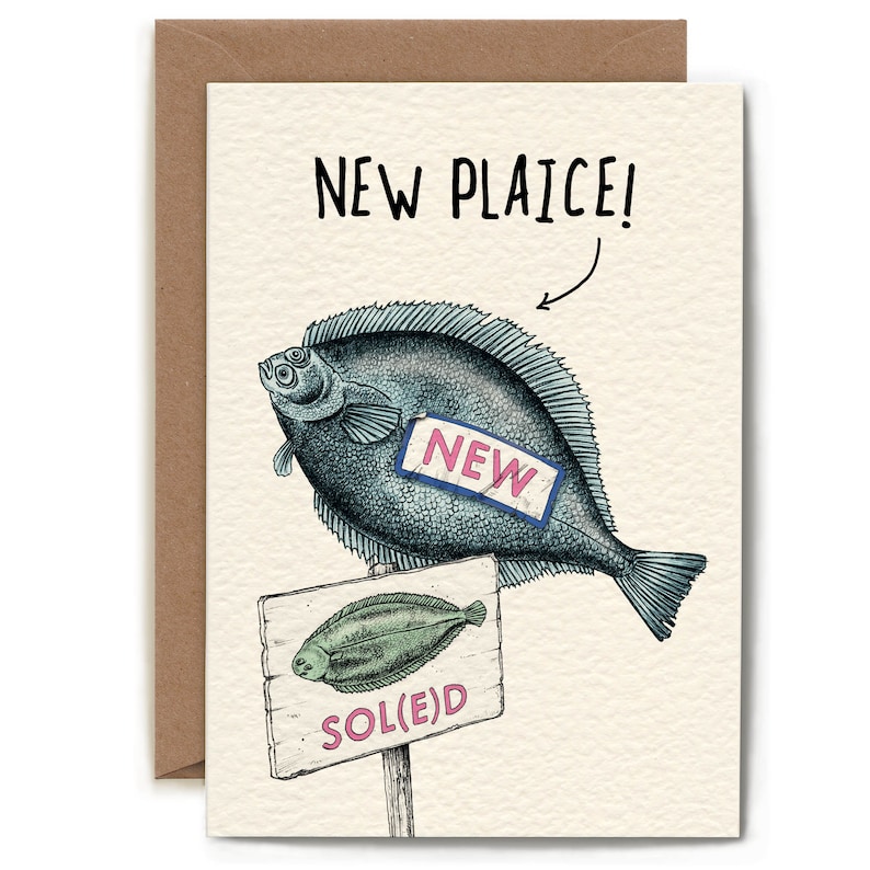 May include: A humorous greeting card featuring a cartoon illustration of a fish labelled "NEW" and a sign that reads "SOL(E)D". The card has the text "NEW PLAICE!" at the top.