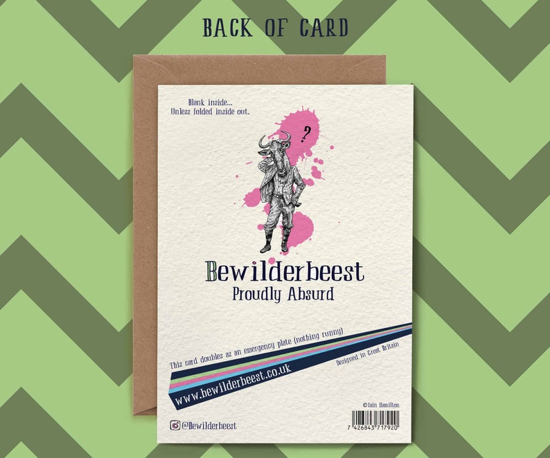 May include: A brown card with a pink and white illustration of a wildebeest wearing a hat and holding a cane. The text "Bewilderbeest Proudly Absurd" is printed on the card. The card also includes the website address "www.bewilderbeest.co.uk" and the social media handle "@Bewilderbeest".