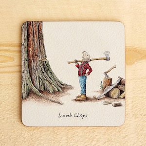May include: Square coaster featuring a cartoon rabbit dressed as a lumberjack, with an axe over its shoulder. The rabbit wears a red and black checked shirt, blue jeans, and boots. The text "Lamb Chops" is written at the bottom of the coaster.