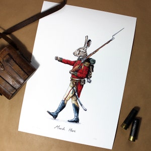 May include: A whimsical illustration of a hare dressed as a soldier, holding a rifle and wearing a red coat, white pants, and a black belt. The hare is marching forward with a determined expression. The illustration is titled "March Hare".